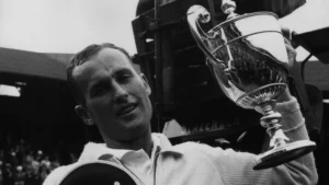 Mal Anderson holding trophy after historic US Open victory