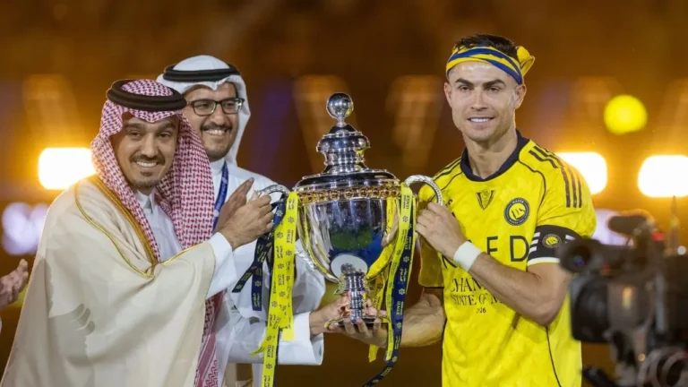 Cristiano Ronaldo holding Saudi Pro League trophy after Ronaldo Title victory with Al Nassr