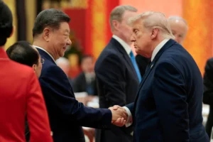 Donald Trump and Xi Jinping shaking hands during the Trump Xi Summit in Beijing