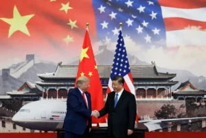US President Donald Trump shakes hands with Chinese President Xi Jinping during the Trump Xi Summit in Beijing at Zhongnanhai Garden with American and Chinese flags in background, representing diplomatic talks on trade and Taiwan.