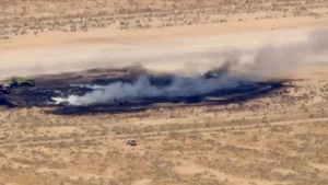 Aerial view of the B-52 crash site at Edwards Air Force Base in California showing the burned wreckage and smoke after the B-52 crash.