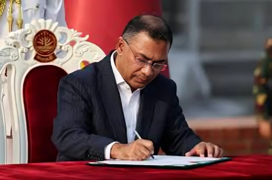 Senior Bangladesh government official signing documents amid the Bangladesh India Protest over the questioning of PM’s adviser at Delhi airport