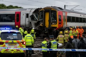 Emergency responders and rescue teams at the scene of the Bedford Train Collision involving two passenger trains near Bedford, England.