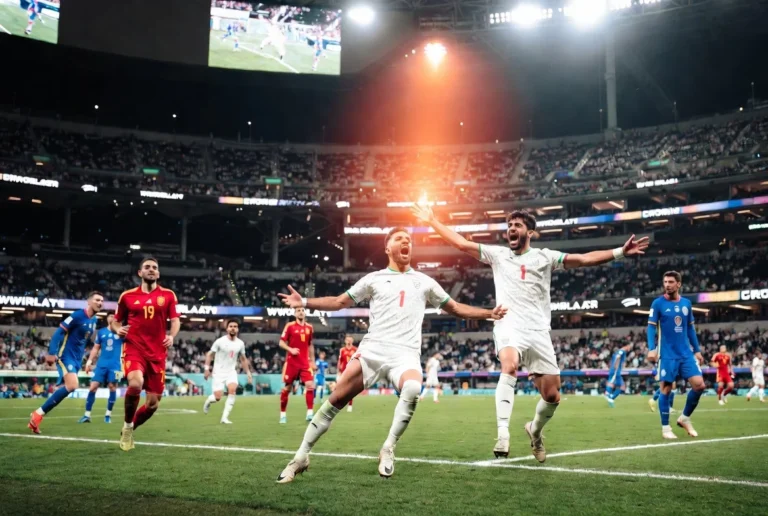 Iran World Cup players joyfully celebrating after scoring a late equalizer in their 2-2 draw against New Zealand at the 2026 FIFA World Cup opener at SoFi Stadium in Los Angeles
