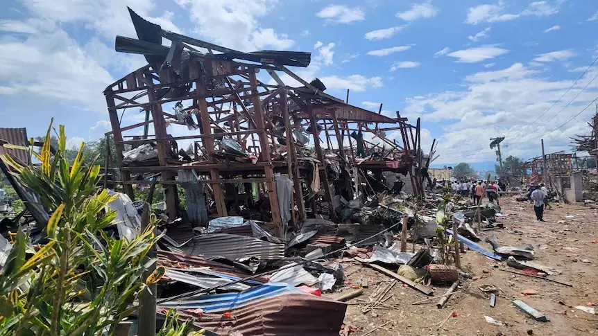Destroyed buildings and debris after the Myanmar village blast that killed dozens and injured many residents.