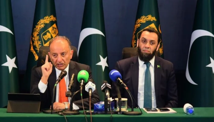 Federal ministers addressing press conference in Islamabad on Pakistan IWT dispute, highlighting water rights and Indus Waters Treaty issues with national flags in background.
