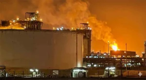 Industrial gas facility at Ras Laffan during the Qatar LNG Explosion incident with flames and smoke visible.