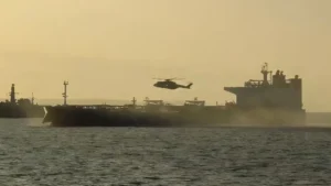 UK Royal Marine Commandos helicopter approaching Russian shadow fleet tanker during interdiction operation in the English Channel