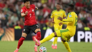 Son Heung min of South Korea challenges a South Africa player during the South Korea World Cup match that ended in a disappointing group stage exit.