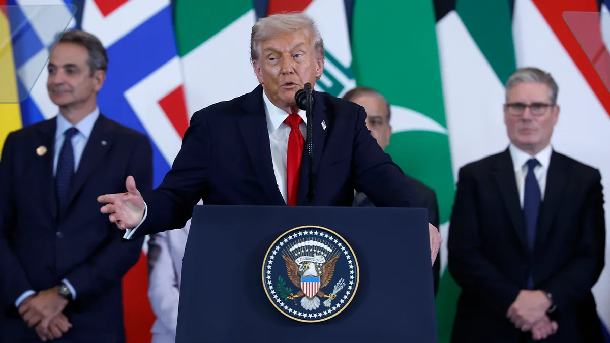 Donald Trump delivers a speech during an international event as Trump Iran tensions remain high amid ongoing peace talks in Switzerland.