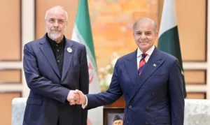 Iranian and Pakistani leaders shaking hands during discussions related to the US Iran Peace Deal