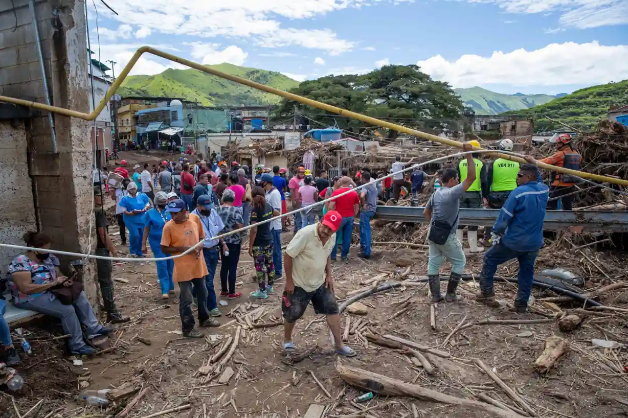 Rescue teams and volunteers search through earthquake debris in La Guaira after the Venezuela Earthquake.