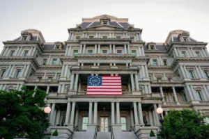 White House administrative building displaying an American flag during the White House shake up and National Security Council restructuring.