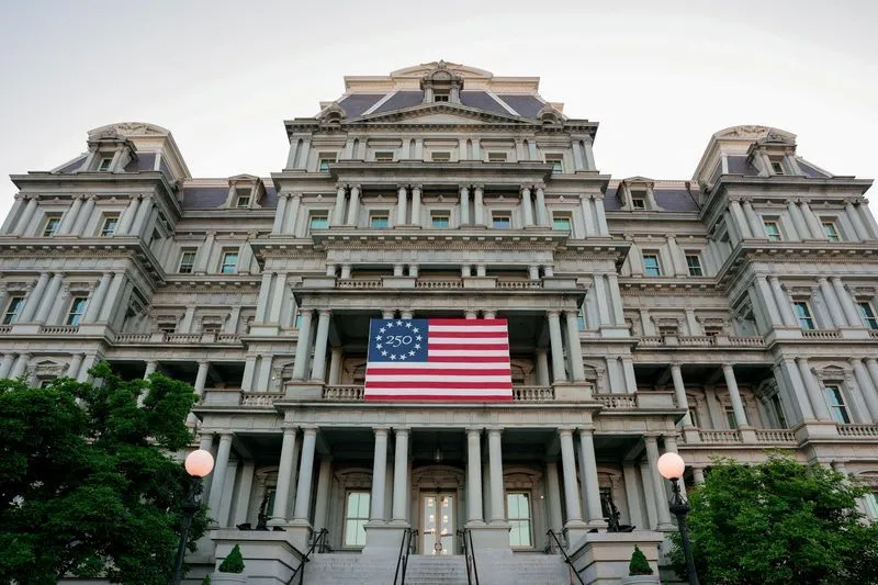 White House administrative building displaying an American flag during the White House shake up and National Security Council restructuring.