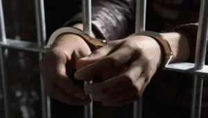 Handcuffed suspect behind prison bars after Ahmad Raza Dar was granted a five day physical remand in the foreign nationals assault case.