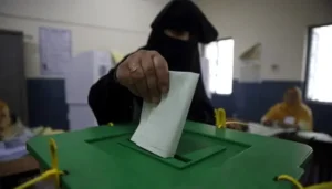 Woman casting her vote during AJK Elections at a polling station in Mirpur Division.