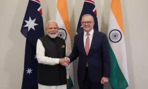 Indian Prime Minister Narendra Modi and Australian Prime Minister Anthony Albanese shake hands after signing the Australia Uranium agreement for peaceful nuclear cooperation.