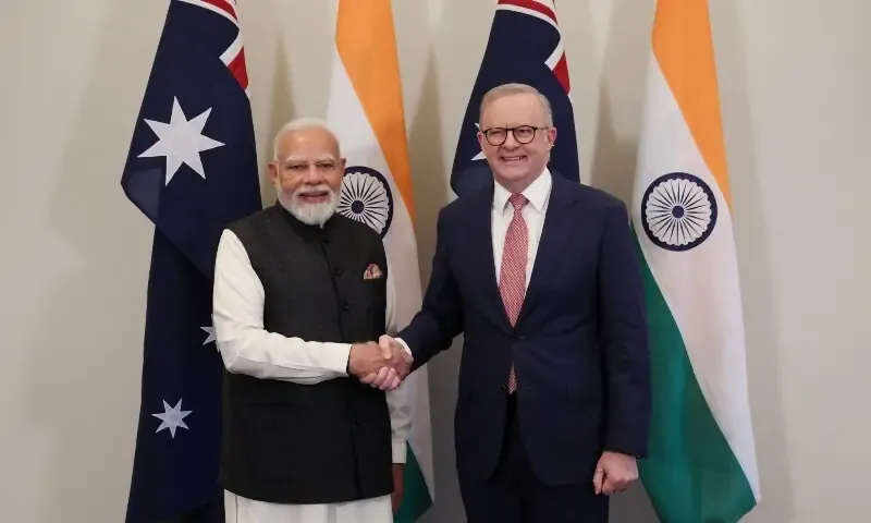 Indian Prime Minister Narendra Modi and Australian Prime Minister Anthony Albanese shake hands after signing the Australia Uranium agreement for peaceful nuclear cooperation.