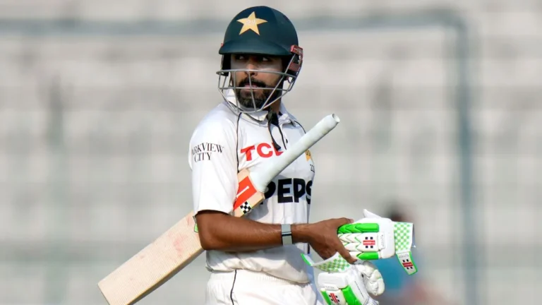 Babar Azam walks onto the field during a Pakistan Test match after returning as Test captain.