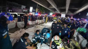 Emergency responders and rescue teams at the scene of the Bangkok pub fire that killed at least 27 people in Thailand.