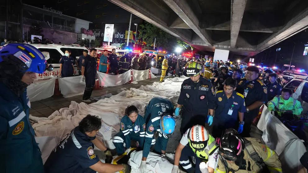 Emergency responders and rescue teams at the scene of the Bangkok pub fire that killed at least 27 people in Thailand.