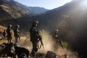 Pakistani security forces conducting Bannu Operation against terrorists in rugged mountainous terrain of Khyber Pakhtunkhwa,