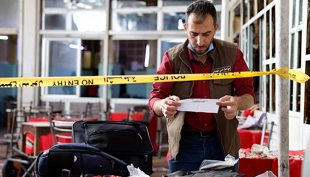 Investigator examining the Damascus Cafe Blast site after an explosion killed six people in central Syria