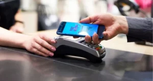 Customer making a contactless smartphone payment at a POS terminal, highlighting Digital Payments growth in Pakistan.