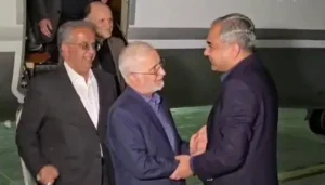 Iranian Interior Minister Eskandar Momeni shakes hands with Interior Minister Mohsin Naqvi upon arriving in Pakistan during his official visit.