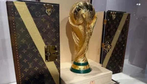 The FIFA Trophy displayed alongside its bespoke Louis Vuitton trunk ahead of the FIFA World Cup.