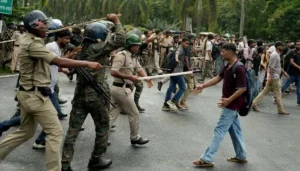 Police use batons against student protesters during Indian Youth Protests in New Delhi over the exam paper leak controversy.
