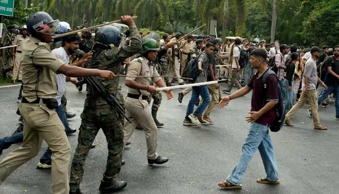 Police use batons against student protesters during Indian Youth Protests in New Delhi over the exam paper leak controversy.