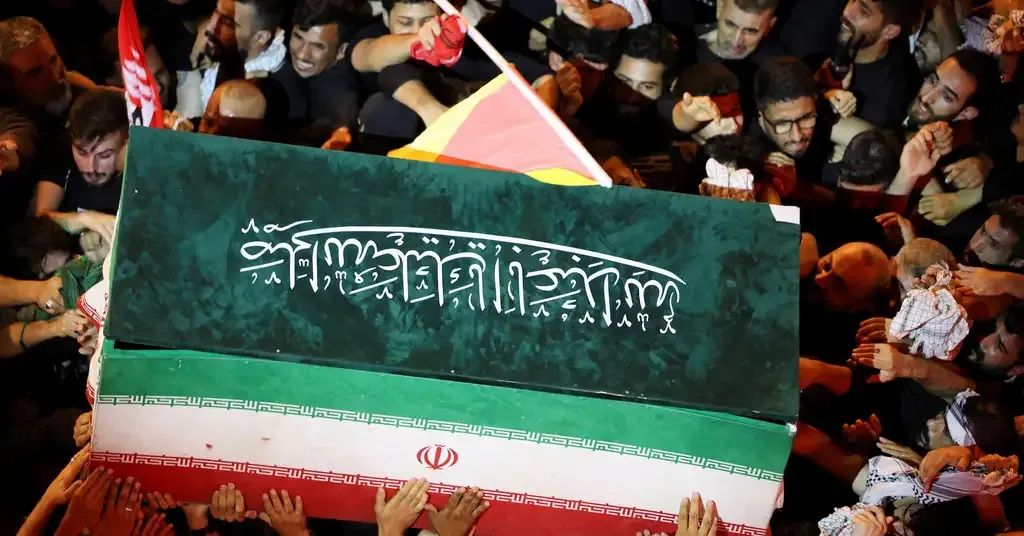 Crowds carry the coffin during the Iran Khamenei funeral procession in Mashhad as regional tensions continue to escalate.