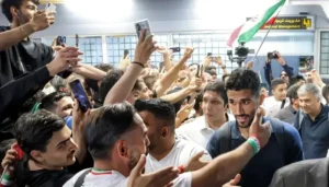 Iran World Cup squad receives a warm welcome from fans at Tehran airport after the FIFA World Cup.