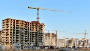 Kuwait Housing construction project featuring residential apartment buildings under development with cranes.