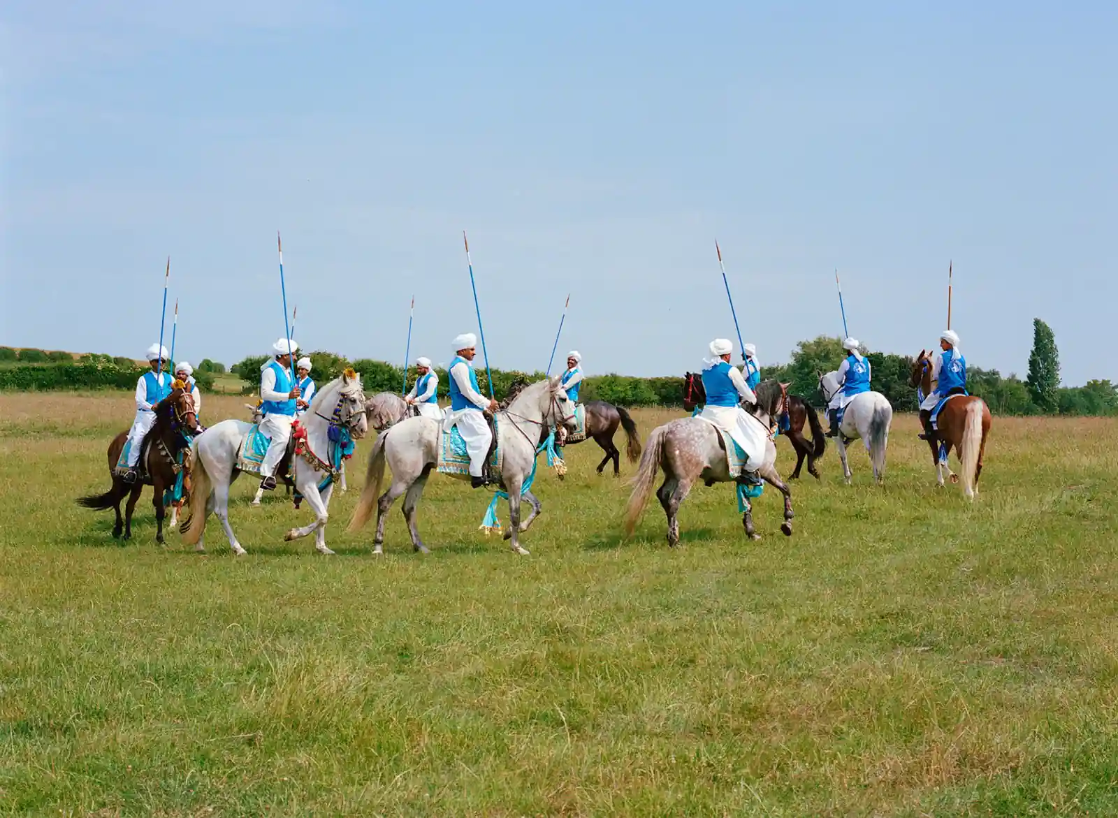 Riders on horseback compete in the London Nezabazi tent pegging event, showcasing Pakistan's traditional equestrian sport in the United Kingdom.