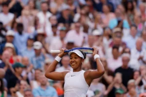Naomi Osaka celebrates after defeating Aryna Sabalenka to reach the Naomi Osaka Wimbledon quarterfinal at the All England Club.