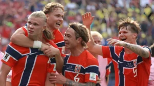 Erling Haaland celebrates with Norway teammates after the Norway vs Brazil FIFA World Cup Round of 16 victory.
