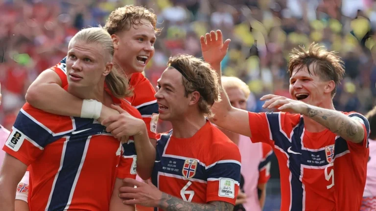 Erling Haaland celebrates with Norway teammates after the Norway vs Brazil FIFA World Cup Round of 16 victory.
