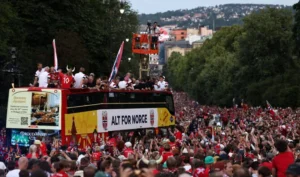 Norway World Cup players celebrate with thousands of supporters during the homecoming bus parade in Oslo after their memorable FIFA World Cup campaign.