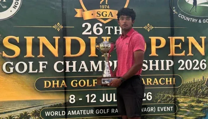 Omar Khalid holding the Sindh Open Golf Championship trophy after becoming the first amateur to win the tournament in Karachi.