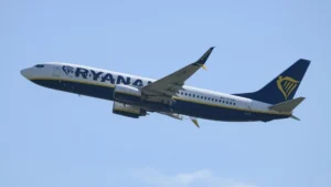 Ryanair Flight aircraft in the sky after making an emergency return following a mid air window damage incident.