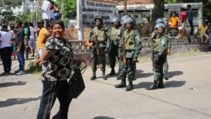 Security personnel stand guard outside a detention facility following the Sri Lanka prison clash that left multiple people dead and injured.