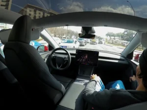 Interior view of a Tesla Robotaxi operating in traffic during the launch of Tesla's autonomous ride hailing service in Miami.