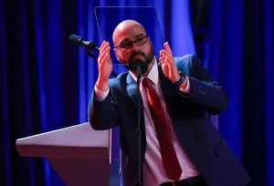 Trump Investigation image showing Donald Trump's teleprompter operator during a public event amid the CFTC insider trading probe.
