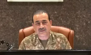 Senior Turkish military general speaking during a security meeting while wearing military uniform.