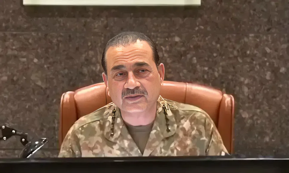 Senior Turkish military general speaking during a security meeting while wearing military uniform.