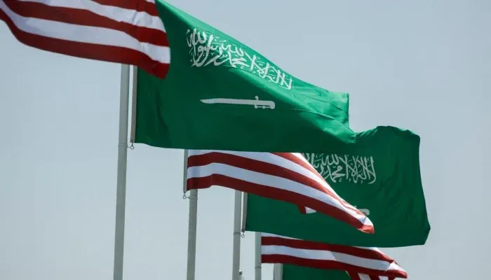 US Saudi Nuclear Deal represented by the United States and Saudi Arabian flags during the landmark civil nuclear cooperation agreement.