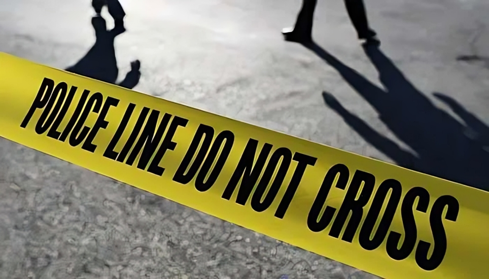 Yellow tape reading "POLICE LINE DO NOT CROSS" blocks off the active crime scene area as investigators collect evidence following a shocking Utah hate crime stabbing.
