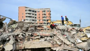 Rescue workers search through collapsed buildings after the Venezuela Earthquake in La Guaira as the death toll nears 3,000.